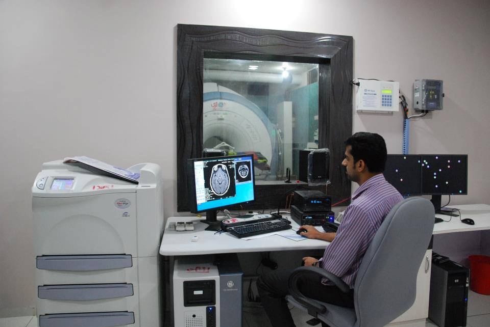 Clinician at an MRI control console