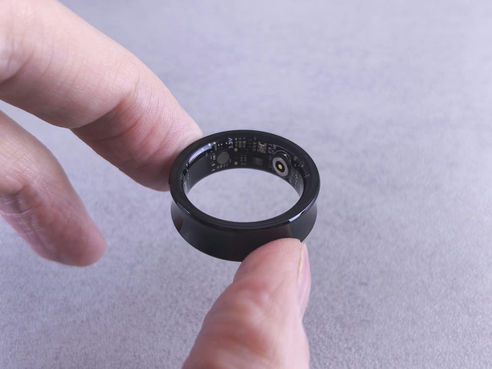 Hand holding a smart ring